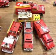 CORGI: A diecast toy fire truck together with four