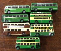 A collection of diecast toy buses and coaches of m