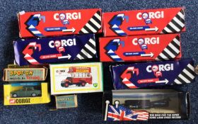 A boxed CORGI diecast toy bus together with other