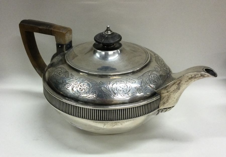 A good heavy Georgian silver teapot attractively d
