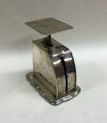 A pair of novelty silver miniature kitchen scales