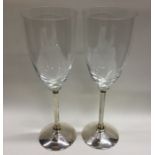 A good pair of silver and glass champagne flutes o