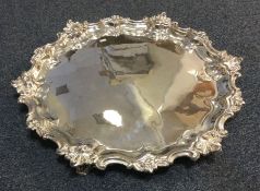 A massive Edwardian silver salver with cast border