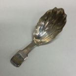 A Georgian fiddle pattern silver caddy spoon with