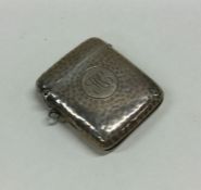 A large hammered effect silver vesta case with hin