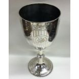 A large silver goblet attractively decorated with