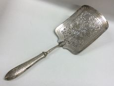 A heavy Chinese silver slice decorated with flower
