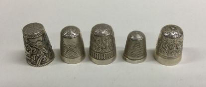 A group of five heavy silver thimbles. Various dat