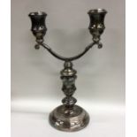 A good cast silver candelabra of typical form on c