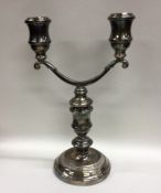 A good cast silver candelabra of typical form on c