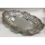 A heavy chased silver fruit bowl decorated with vi