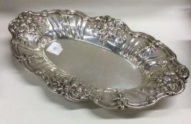A heavy chased silver fruit bowl decorated with vi