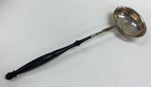 A Georgian silver toddy ladle with coin inset bowl