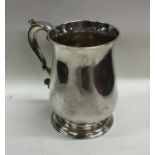 A good Georgian silver baluster shaped mug on spre