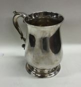 A good Georgian silver baluster shaped mug on spre