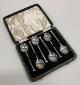 A cased set of six nail top silver teaspoons. Appr