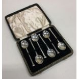 A cased set of six nail top silver teaspoons. Appr