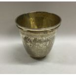 A good tapering silver gilt Antique beaker on reed