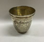 A good tapering silver gilt Antique beaker on reed