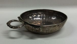 An 18th Century silver wine taster of typical form