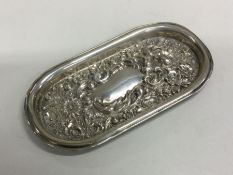 A heavy chased silver bonbon dish decorated with f