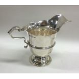 A Georgian style cast silver cream jug of Irish de