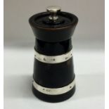 A silver mounted and ebony pepper grinder of taper