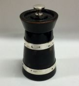 A silver mounted and ebony pepper grinder of taper