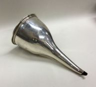 A heavy Georgian silver wine funnel and strainer w