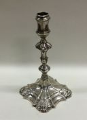 A heavy cast Victorian silver taper stick of typic