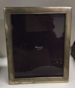 A good quality large silver picture frame with pan