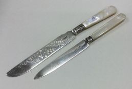 A silver and MOP butter knife together with one ot