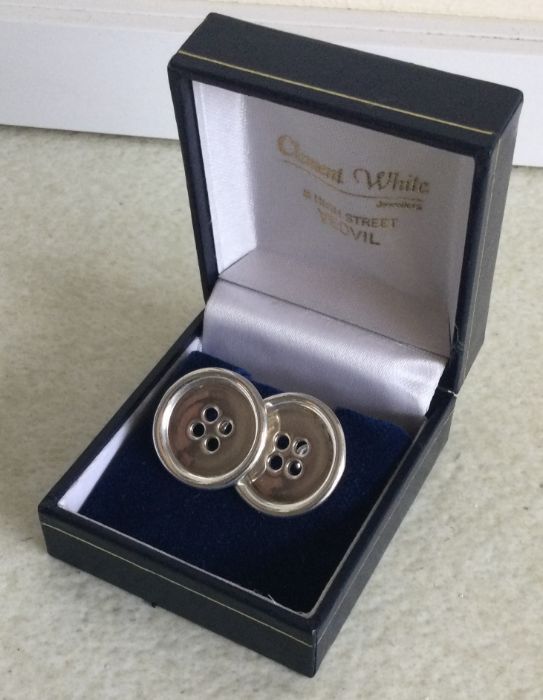 A pair of cased silver cufflinks in the form of bu