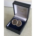 A pair of cased silver cufflinks in the form of bu