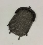 A small silver miser's purse of mesh design. Appro