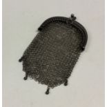 A small silver miser's purse of mesh design. Appro