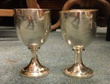 A good pair of Georgian silver goblets of plain fo