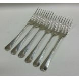 A matched set of six silver three prong forks. App