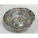 An attractive chased silver bonbon dish decorated
