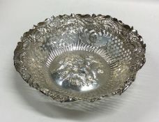 An attractive chased silver bonbon dish decorated