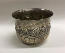 A chased silver half fluted sugar bowl. London. B