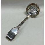 EXETER: A fiddle pattern silver sifter spoon. By J