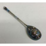 A heavy Russian silver and enamelled spoon attract