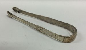 EXETER: A pair of Georgian bright cut silver sugar