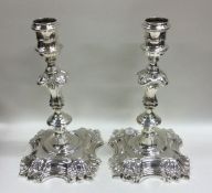 A good pair of Georgian silver cast candlesticks o