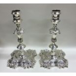 A good pair of Georgian silver cast candlesticks o