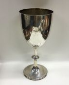 A large silver goblet with beadwork decoration. Lo