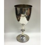 A large silver goblet with beadwork decoration. Lo