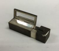 A novelty silver lipstick holder of engine turned