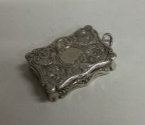 A Victorian hinged silver vinaigrette with gilt in